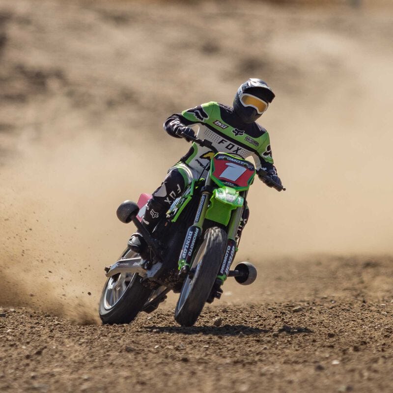  Losi Promoto-MX 1/4 Dirt Bike racer in action on a dirt track