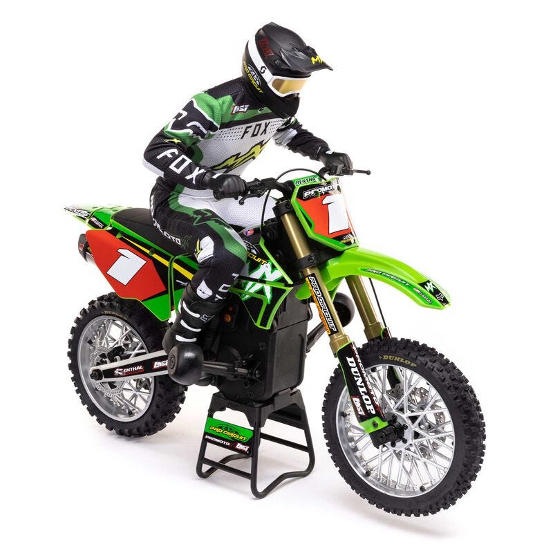 Model of a motocross rider on a green and red  Losi Promoto-MX 1/4 Dirt Bike with detailed graphics.