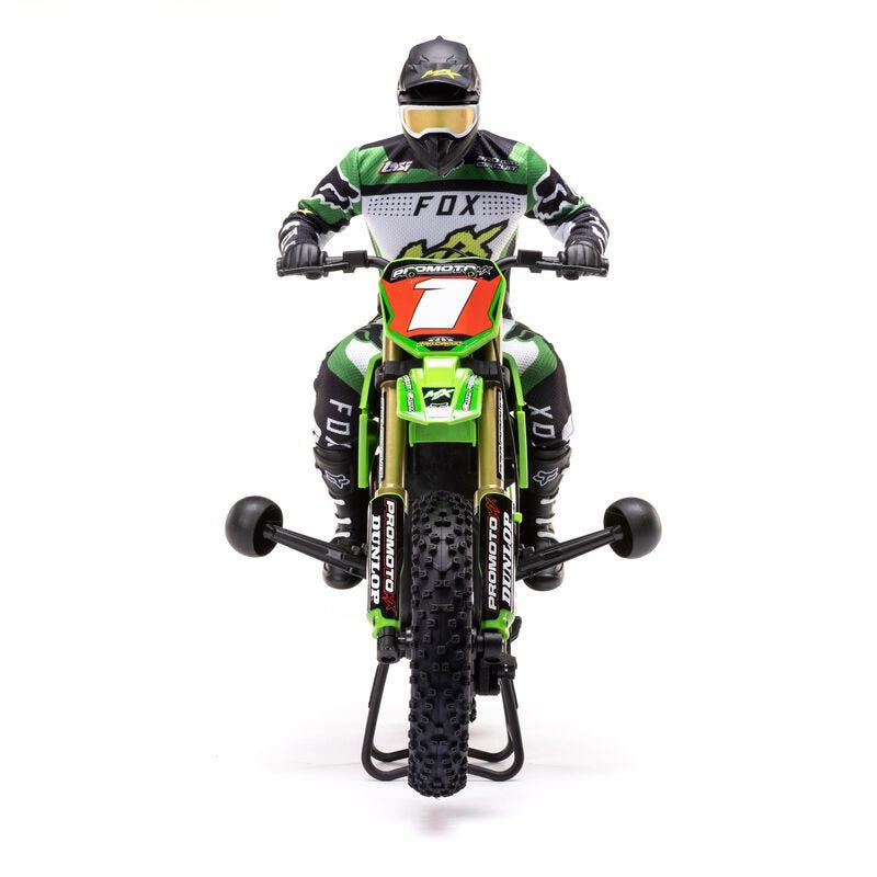 Front view Model of a motocross rider on a green  Losi Promoto-MX 1/4 Dirt Bike with visible branding on a white background