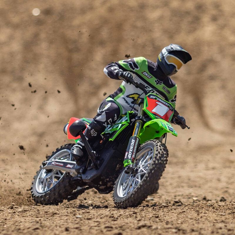  Losi Promoto-MX 1/4 Dirt Bike on a dirt track leaning over around corner
