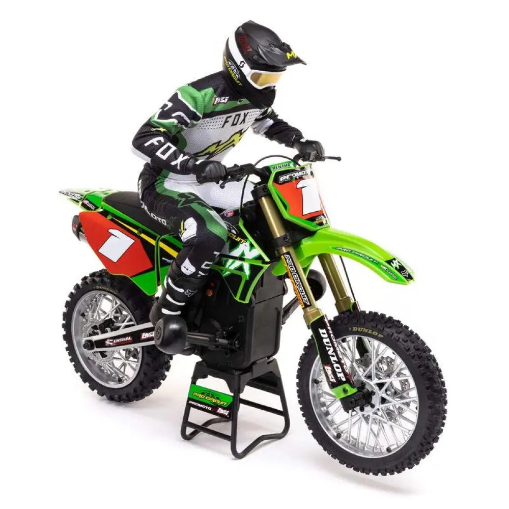 Model of a motocross rider on a green and red  Losi Promoto-MX 1/4 Dirt Bike with detailed graphics.