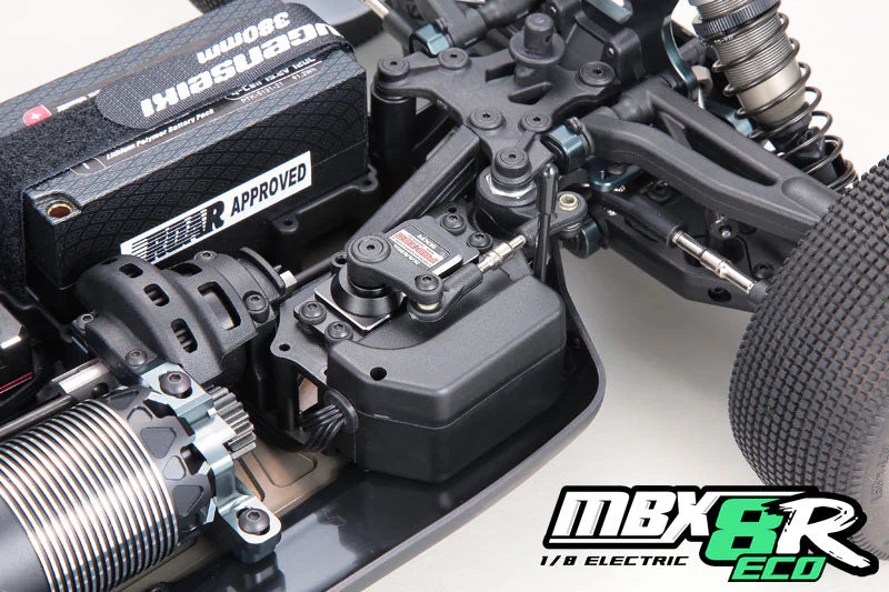 Close-up of a model car chassis with visible branding on a white background